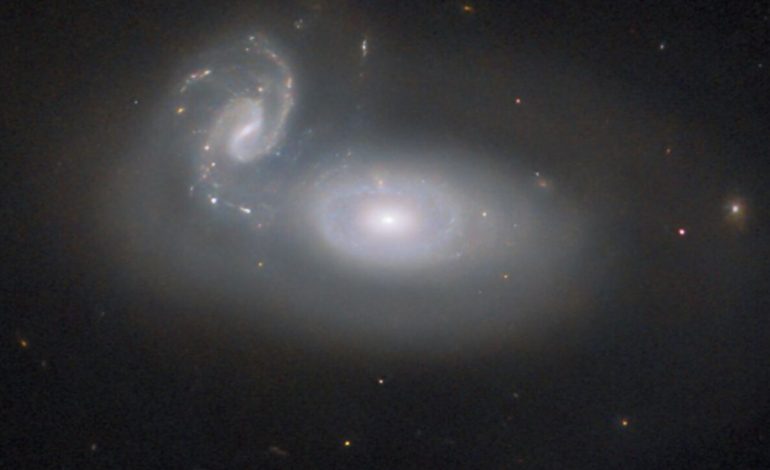 Galaxies are intertwined in ‘the queen’s hair’ in a new image from the Hubble Telescope.