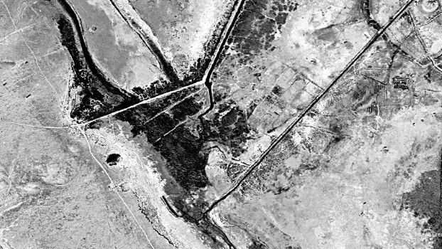 Declassified images from spy satellites uncover a battle site in Iraq that is 1,400 years old and marked the beginning of the Muslim conquest.